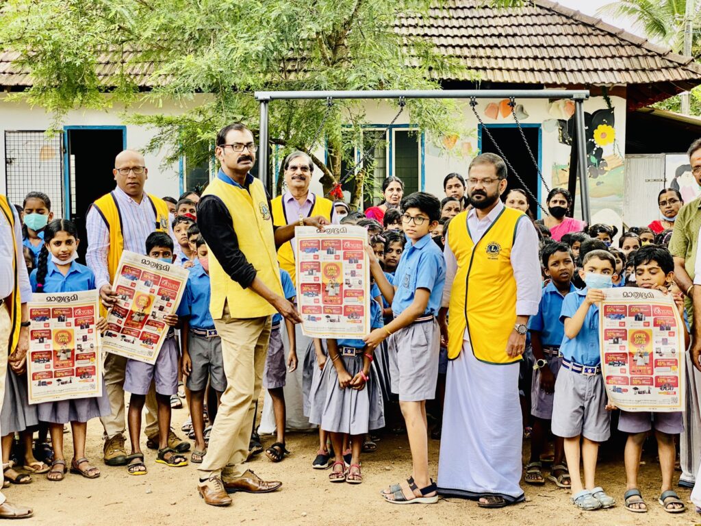 Photo of Mathrubhumi newspaper exhibition and distribution of study materials at Kattoor government school by Lions Club of Kattoor as a Lions Club Service,Lions Club India, Lions Club International, Lion Club Kerala.Featured by www.jamesvalappila.com and authored by Lion James Valappila PMJF