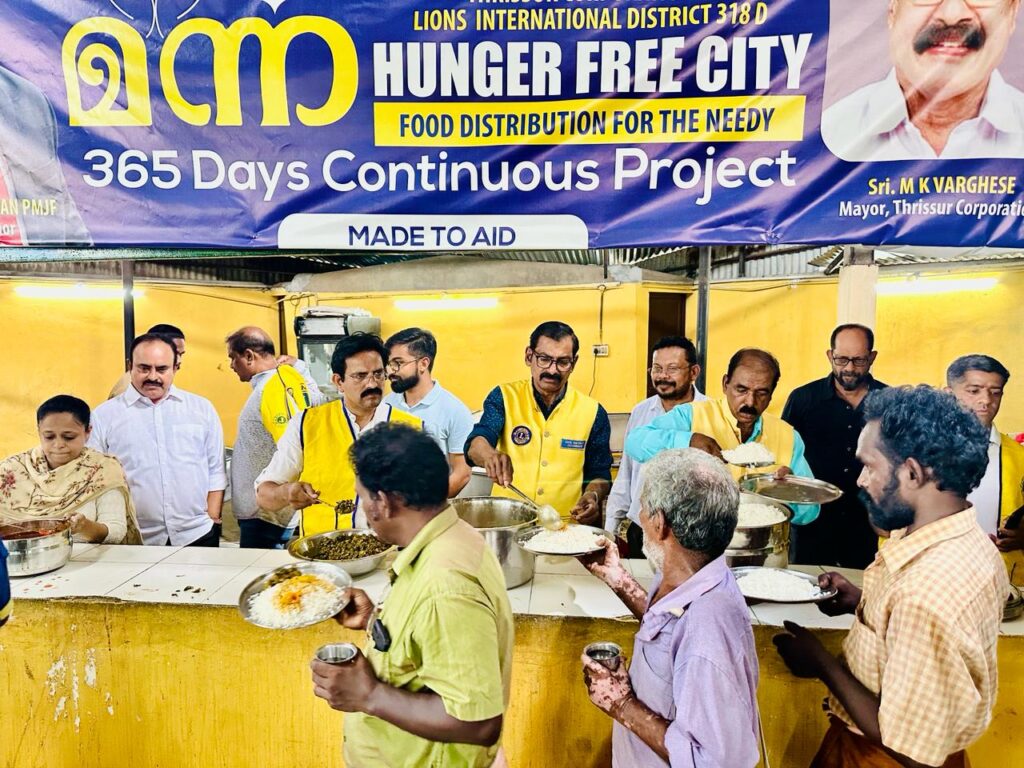 Photo of Lions Manna Hunger Free City Food Distribution.Lions Club of Thrichur orchestrates Manna Hunger Free City day for distributing food to the needy, guided by Lion James Valappila PMJF District 318D. With Lions Hunger Project initiatives, they continue their steadfast fight against hunger, advancing their mission in Kerala communities.Lion Club Kerala.Featured by www.jamesvalappila.com and authored by Lion James Valappila PMJF