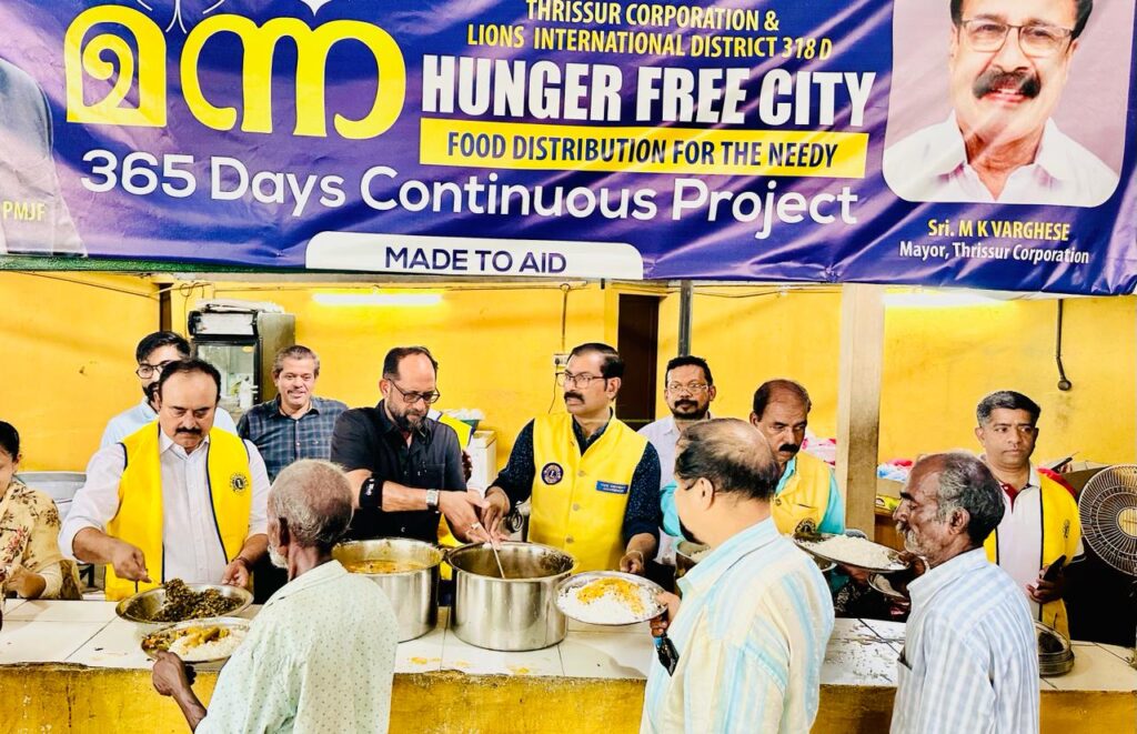 Photo of Lions Manna Hunger Free City Food Distribution.Lions Club of Thrichur orchestrates Manna Hunger Free City day for distributing food to the needy, guided by Lion James Valappila PMJF District 318D. With Lions Hunger Project initiatives, they continue their steadfast fight against hunger, advancing their mission in Kerala communities.Lion Club Kerala.Featured by www.jamesvalappila.com and authored by Lion James Valappila PMJF