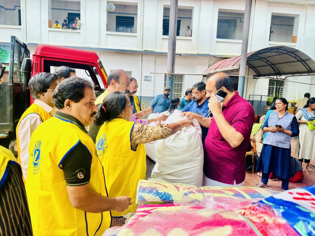 Image of The Lions Club Service distributing mats essential Goods to flood-affected residents in Thrissur, community support amidst the heavy rains and flooding, fostering community support and relief. under the guidance of Lion James Valappila PMJF, District 318D.Lions Club Project ,District 318d,Lions District 318d,
Lions Club India
Lions Club India,
Lions Club Kerala,
Lions Club Activities Project,Lions Childhood Cancer Project,
Lions Club Environment Project,
Lions Vision ProjectLion Club Kerala.Featured by www.jamesvalappila.com and authored by Lion James Valappila PMJF
