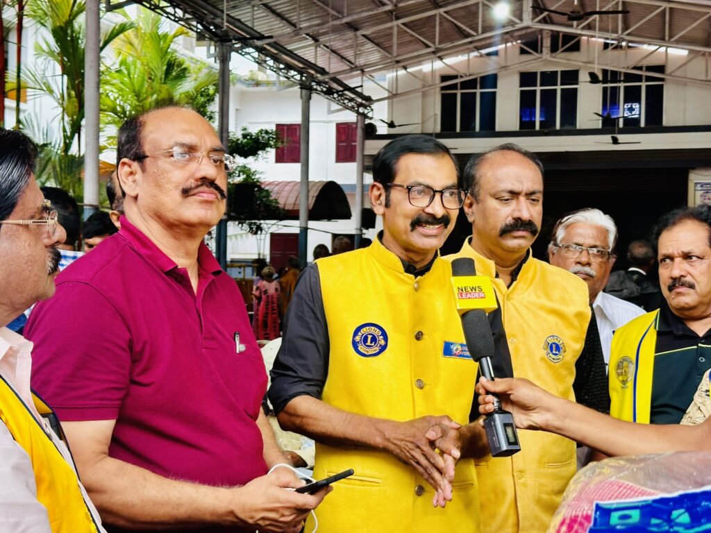 Image of The Lions Club Service distributing mats essential Goods to flood-affected residents in Thrissur, community support amidst the heavy rains and flooding, fostering community support and relief. under the guidance of Lion James Valappila PMJF, District 318D.Lions Club Project ,District 318d,Lions District 318d,
Lions Club India
Lions Club India,
Lions Club Kerala,
Lions Club Activities Project,Lions Childhood Cancer Project,
Lions Club Environment Project,
Lions Vision ProjectLion Club Kerala.Featured by www.jamesvalappila.com and authored by Lion James Valappila PMJF