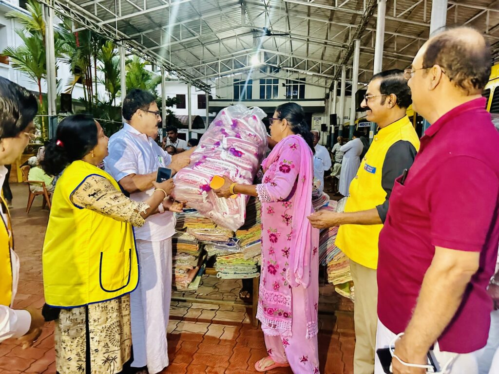 Image of The Lions Club Service distributing mats essential Goods to flood-affected residents in Thrissur, community support amidst the heavy rains and flooding, fostering community support and relief. under the guidance of Lion James Valappila PMJF, District 318D.Lions Club Project ,District 318d,Lions District 318d,
Lions Club India
Lions Club India,
Lions Club Kerala,
Lions Club Activities Project,Lions Childhood Cancer Project,
Lions Club Environment Project,
Lions Vision ProjectLion Club Kerala.Featured by www.jamesvalappila.com and authored by Lion James Valappila PMJF